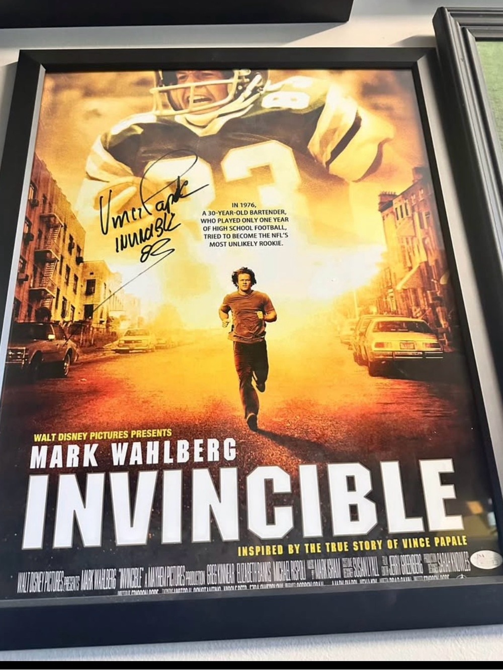 Invincible Movie Autographed Poster and Jersey.